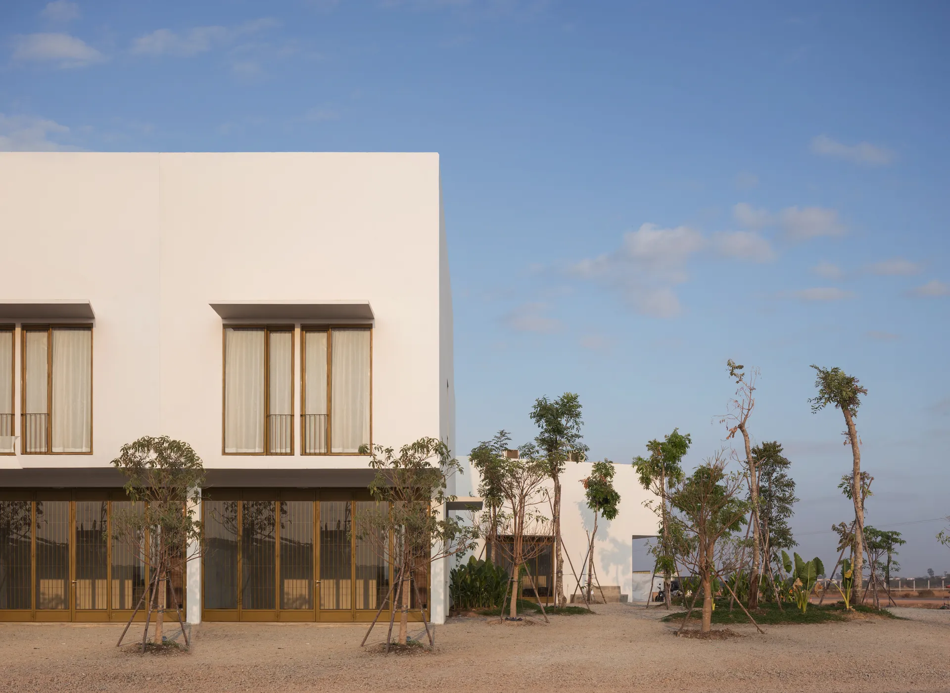 Bakong Village — a home facade with planting, daytime view (photo)