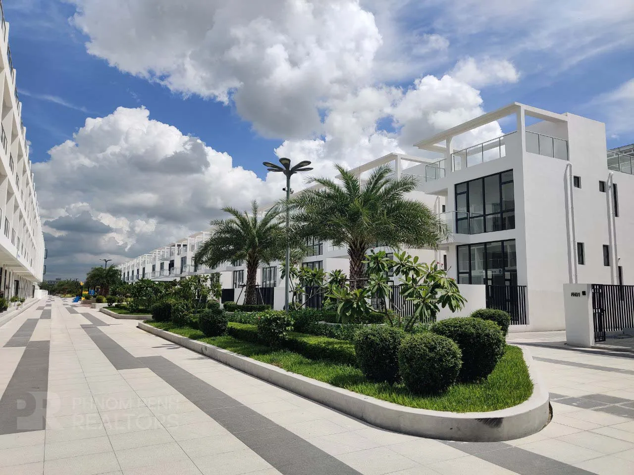 Completed Morgan Park Villa homes on a landscaped internal street in Bak Kaeng, Chroy Changvar
